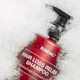 ProtoClinical k-beauty KUNDAL HAIR LOSS RELIEF SHAMPOO Intensive Scalp Care with Caffeine 500ml #WHITE MUSK single upright deep rose shampoo bottle centered on a light background with pale mint side accents.