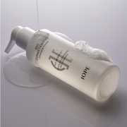 ProtoClinical k-beauty muted olive beauty product on a soft gray and lavender background.