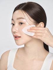 ProtoClinical k-beauty narrow skincare product on a beige and pale blue background.