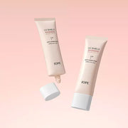ProtoClinical k-beauty IOPE UV Shield Essential Tone-up Sun SPF 50+ PA++++ 50ml light beige skincare product on a pale pink gradient background