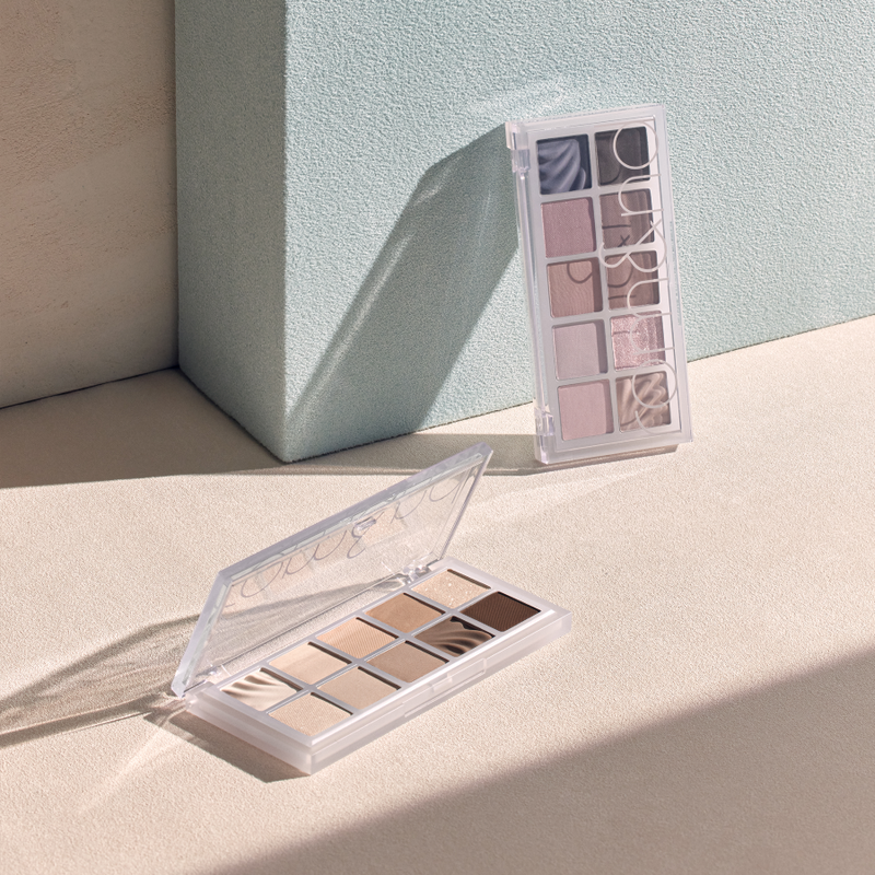 ProtoClinical k-beauty taupe beauty product silhouette with a soft gray center on a pale beige background.