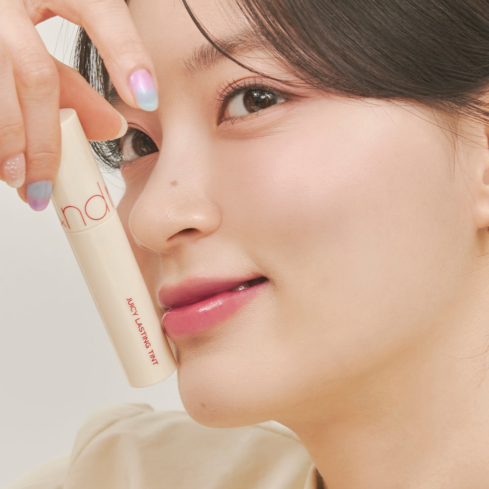 ProtoClinical k-beauty rom&nd JUICY LASTING TINT Milk Grocery Series 28 BARE FIG 29 PAPAYA JAM single peach-beige lip tint package centered on a clean light background