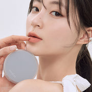 ProtoClinical k-beauty rom&nd NU ZERO CUSHION 5color single cushion compact with beige tones centered on a light background.
