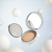 ProtoClinical k-beauty rom&nd NU ZERO CUSHION 5color shown as a single gray-beige cushion package centered on a pale blue and white background