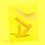 ProtoClinical k-beauty beplain Chamomile Dual Moisturizing Lip Balm 3.6g single bright yellow lip balm package angled diagonally on a vivid yellow background
