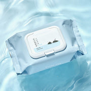 ProtoClinical k-beauty Round Lab 1025 Dokdo Cleansing Tissue 30ea light blue cleansing tissue pack resting diagonally on a rippled water background
