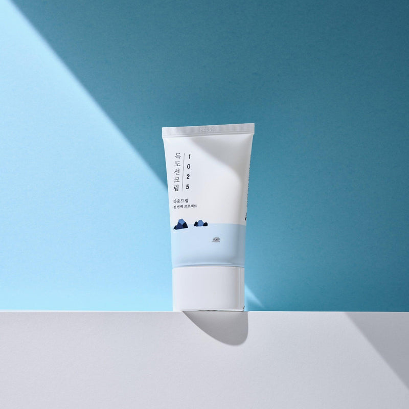 ProtoClinical k-beauty Round Lab 1025 Dokdo Sunscreen 50ml (SPF 50+ PA++++) single sunscreen tube on a light background
