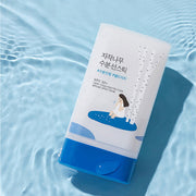 ProtoClinical k-beauty Round Lab Birch Juice Moisturizing Sun Stick 19g (SPF 50+ PA++++) single white sun stick package angled on a rippled light blue water background