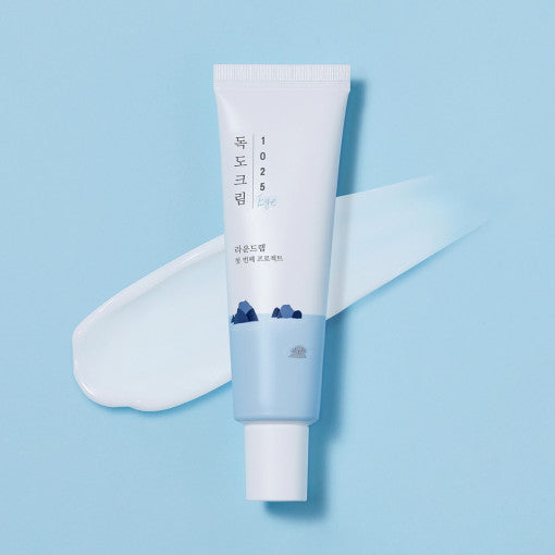 ProtoClinical k-beauty light blue beauty product packaging on a pale background.