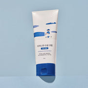 ProtoClinical k-beauty abstract beauty graphic with soft aqua and blue-gray tones and a darker lower center on a pale background.