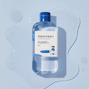 ProtoClinical k-beauty abstract beauty graphic with layered blue tones and a darker upper-right area.