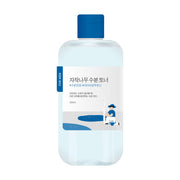 ProtoClinical k-beauty beauty product silhouette with a pale blue vertical center on a white background with soft peach side accents.
