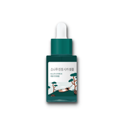 ProtoClinical k-beauty pale blue beauty product silhouette with soft peach side accents on a white background.