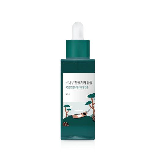 ProtoClinical k-beauty beauty product silhouette with a dark gray vertical center on a white background with soft peach side accents.
