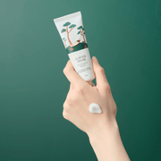 ProtoClinical k-beauty abstract beauty graphic with a deep teal field and a pale cream vertical center.