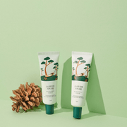 ProtoClinical k-beauty abstract beauty graphic with soft green bands and a darker green lower-left accent.