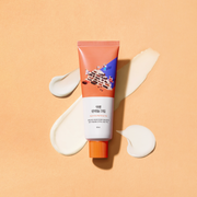 ProtoClinical k-beauty warm beige beauty product silhouette on a soft peach background.