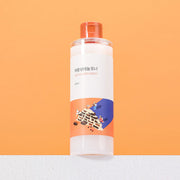 ProtoClinical k-beauty Round Lab Soybean Panthenol Toner 250ml single upright amber toner bottle on a warm beige background with a white base.