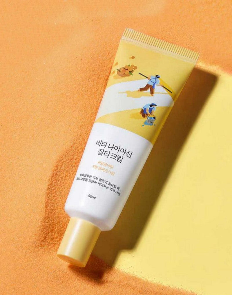 ProtoClinical k-beauty Round Lab Vita Niacin Blemish Cream 50ml graphic with warm orange tones and pale yellow right-side accents.