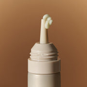 ProtoClinical k-beauty goodal Black Carrot Vita-A Retinol Eye Cream 30ml close-up of the beige applicator tip with pale cream on a warm beige background
