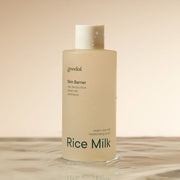 ProtoClinical k-beauty goodal Vegan Rice Milk Moisturizing Toner 250ml single upright pale cream toner bottle centered on a warm beige background with soft brown side shading.