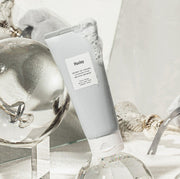 ProtoClinical k-beauty Huxley Cleansing Foam ; Deep Clean, Deep Moist 150g with beige and gray packaging forms on a pale background
