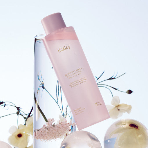 ProtoClinical k-beauty Huxley Skin Glow Toner Vita Radiance 200ml lavender package silhouette with a pale blue side panel on a light background.