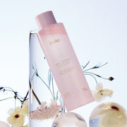 ProtoClinical k-beauty Huxley Skin Glow Toner Vita Radiance 200ml lavender package silhouette with a pale blue side panel on a light background.