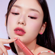 ProtoClinical k-beauty ETUDE Fruity Dewy Tint 4.5g single upright peach-coral lip tint package centered on a light background with dark side shading