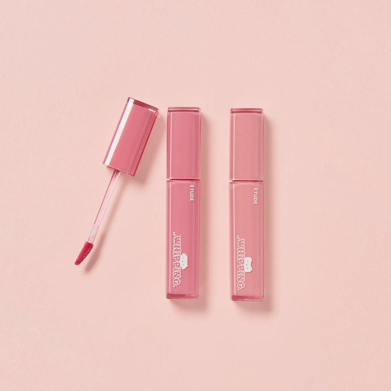 ProtoClinical k-beauty ETUDE Whipping Fruity Dewy Tint 4.5g soft rosy lip tint swatch in a wide square shape with blurred edges on a pale blue and white background