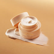 ProtoClinical k-beauty warm peach beauty product detail with soft gold tones on a light background.