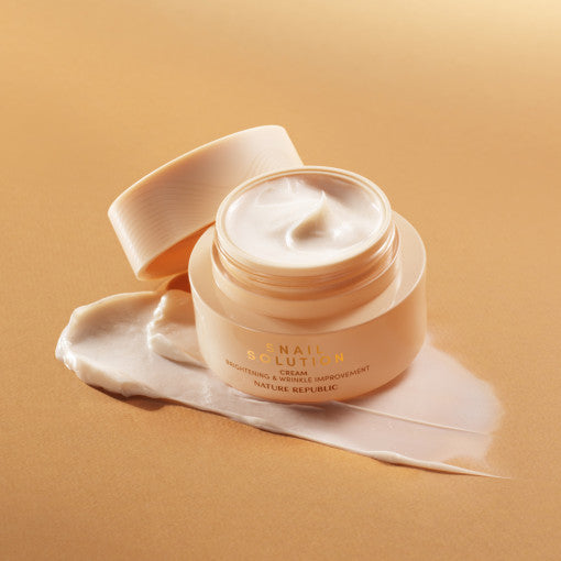 ProtoClinical k-beauty warm peach beauty product detail with soft gold tones on a light background.