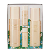 ProtoClinical k-beauty tall beige and pale blue product packaging on a white background with an aqua base.