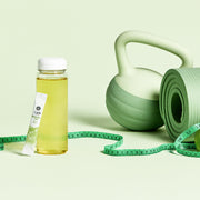 ProtoClinical k-beauty muted olive beauty detail with a pale yellow center on a light background.