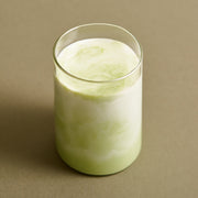 ProtoClinical k-beauty OSULLOC Organic Premium Matcha Powder 40g packaging with a cream vertical panel and dark olive tones on a warm background.