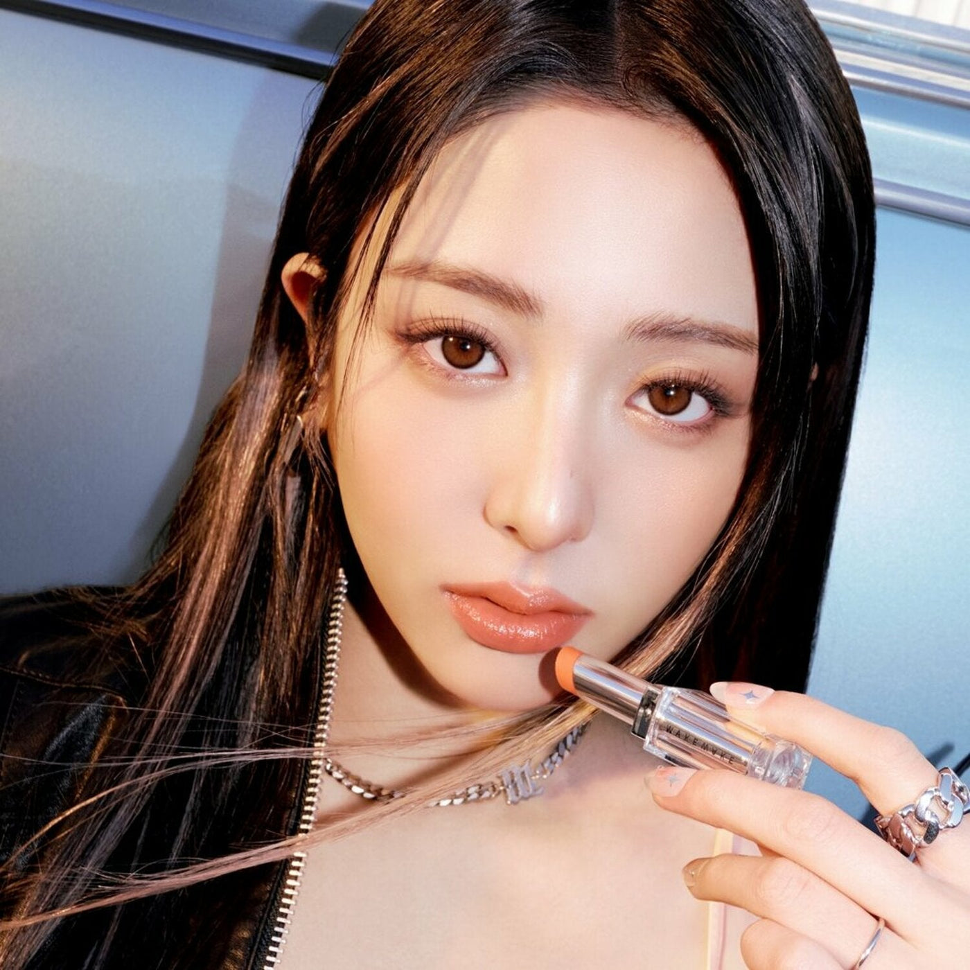 ProtoClinical k-beauty WAKEMAKE Dewy Gel Glaze Stick square product detail graphic with pale lavender bands and a soft light background