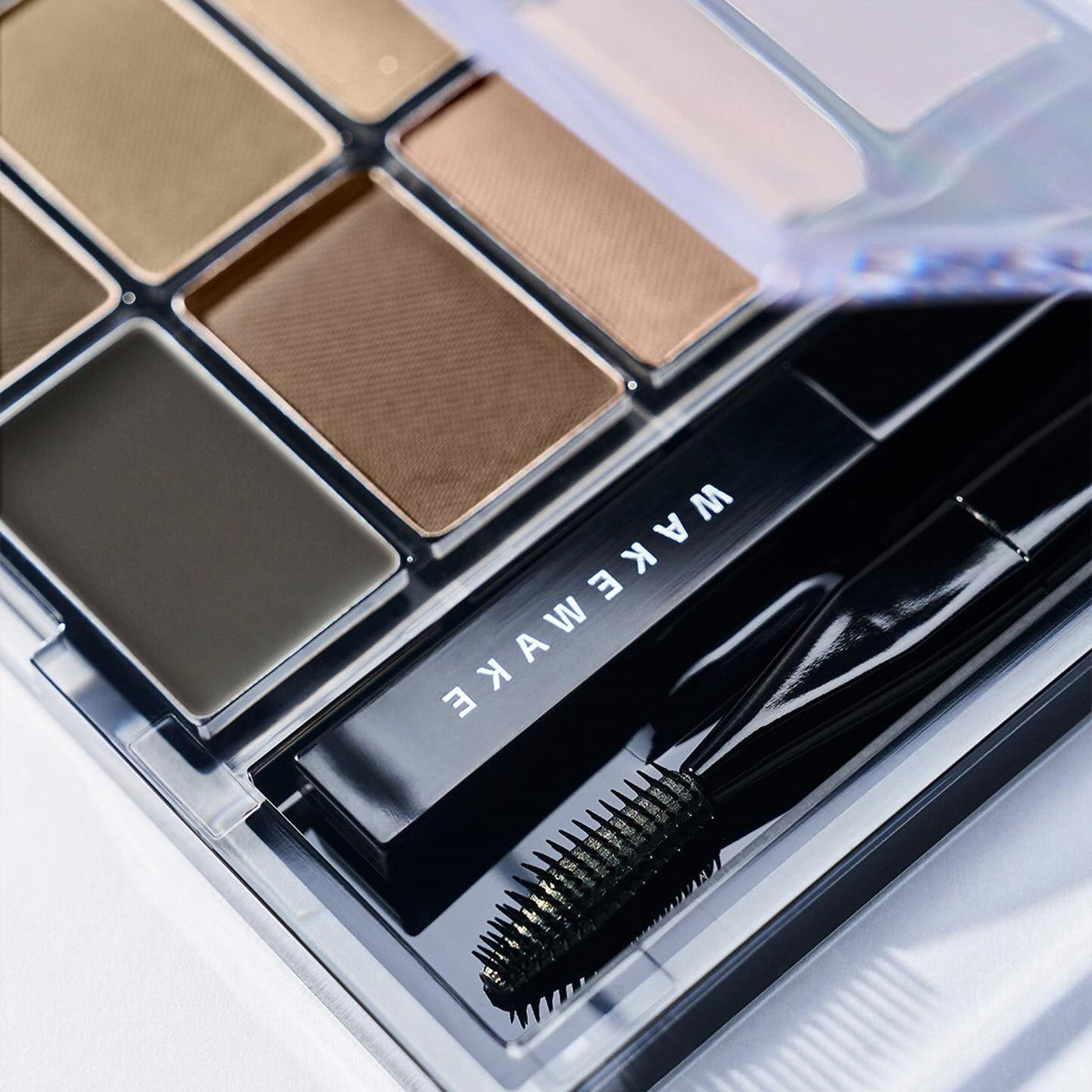 ProtoClinical k-beauty dark blue and gray beauty product layout on a light background.