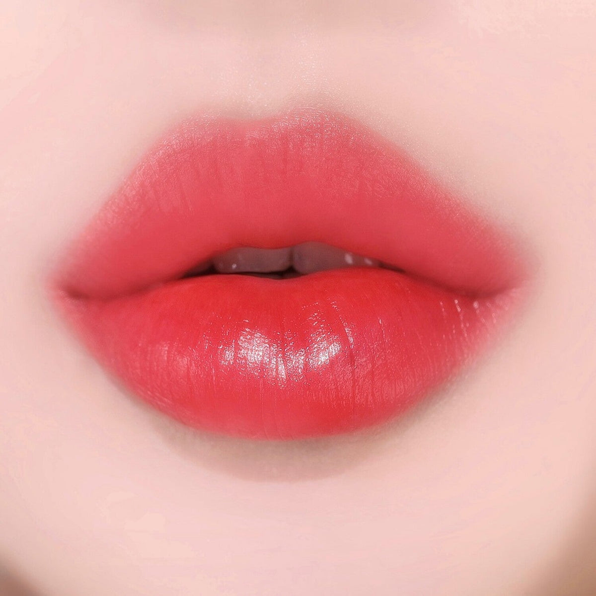 ProtoClinical k-beauty WAKEMAKE Watery Tok Tint square tint shade graphic with coral-rose panels, soft glossy blocks, and a light background