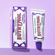 ProtoClinical k-beauty EUTHYMOL Whitening Purple Toothpaste 106g single upright purple toothpaste package centered on a lavender background.