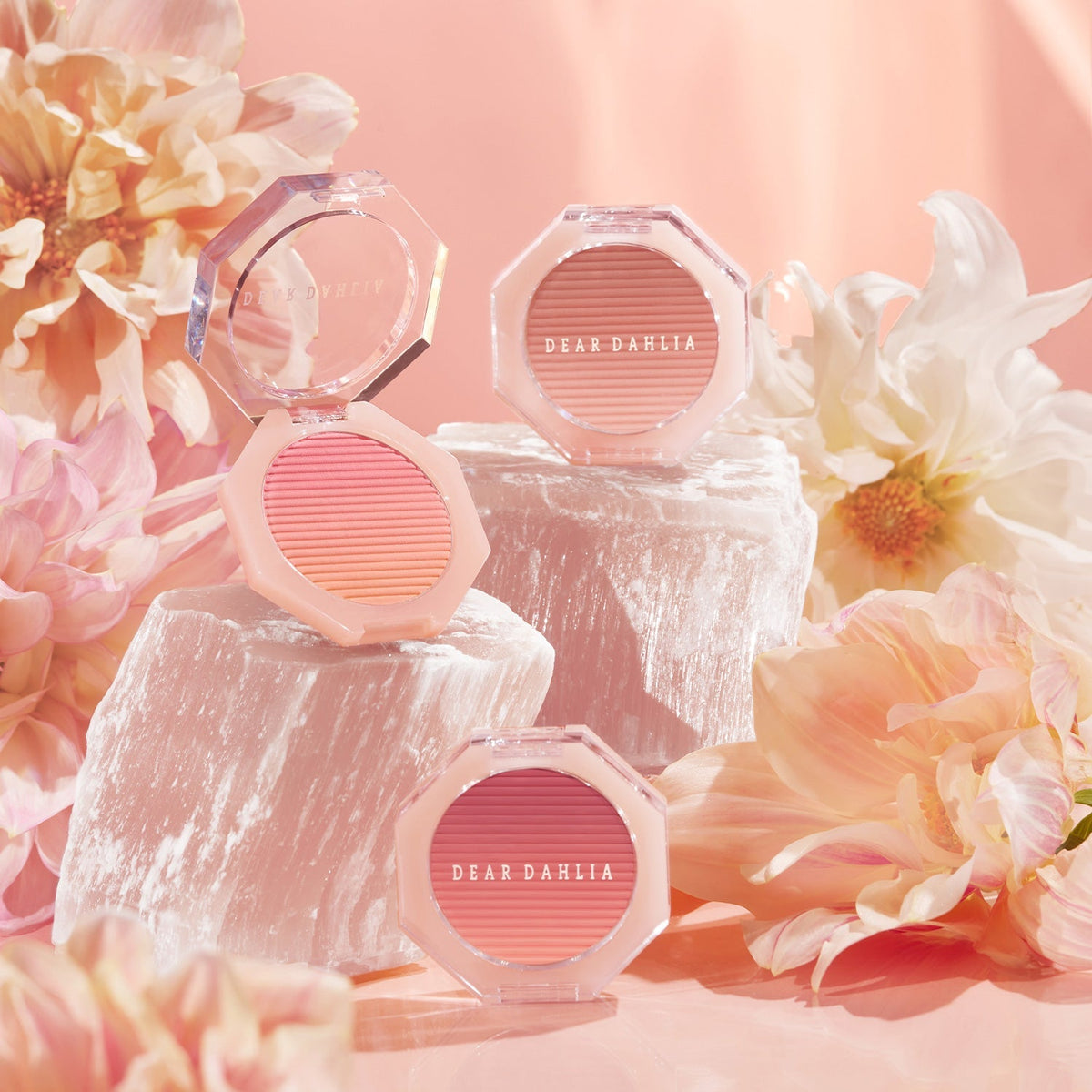 ProtoClinical k-beauty beauty product packaging with soft peach tones and a warm brown lower detail on a light background.