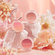 ProtoClinical k-beauty beauty product packaging with soft peach tones and a warm brown lower detail on a light background.