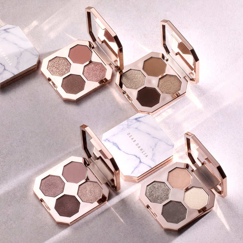 ProtoClinical k-beauty soft beige beauty graphic with blurred vertical bands on a light background.
