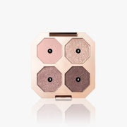 ProtoClinical k-beauty beauty product packaging with a warm beige vertical silhouette and soft blue-gray side shading on a light background.