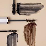 DEAR DAHLIA Paradise Dream Lash Volumizing Mascara by ProtoClinical shown with k-beauty mascara tube and packaging details on a light cream background.