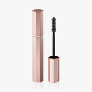DEAR DAHLIA Paradise Dream Lash Volumizing Mascara by ProtoClinical shown as a slim beige k-beauty mascara tube centered on a pale blue and white background.