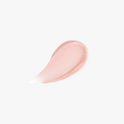 ProtoClinical k-beauty DEAR DAHLIA Paradise Tinted Blooming Balm close-up of soft beige product packaging with muted taupe accents on a light background