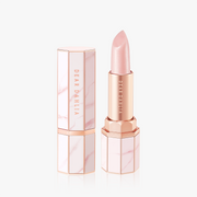 ProtoClinical k-beauty DEAR DAHLIA Paradise Tinted Blooming Balm close-up of soft pink and beige product packaging with a centered vertical design on a light background