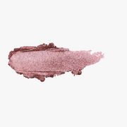 ProtoClinical k-beauty DEAR DAHLIA Perfect Designing Shadow Stick texture shot with a soft pink horizontal shadow swatch on a white background