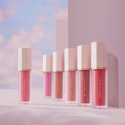 ProtoClinical k-beauty DEAR DAHLIA Petal Drop Liquid Blush shown as horizontal liquid blush swatches layered in mauve bands across a lavender background