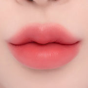 ProtoClinical k-beauty espoir Nowear Lipstick Volume Matte 3g (8 colors) close-up of centered lips with a soft blurred gradient and warm coral lip color